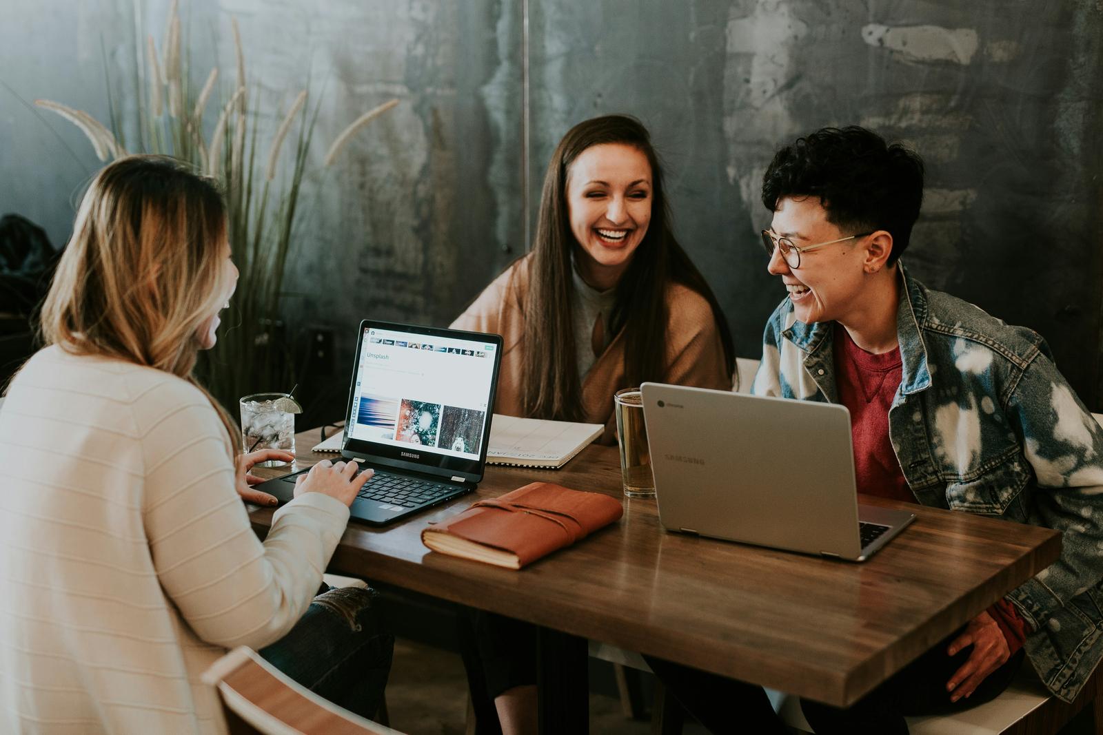 Students collaborating over laptops — the craft behind SoftwareMerit